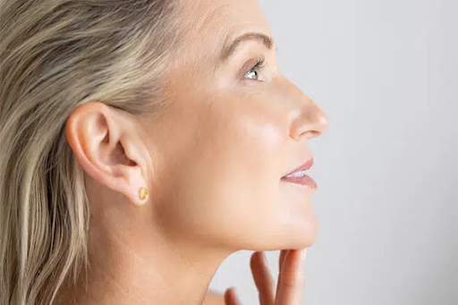 Woman showing her side profile from necktox